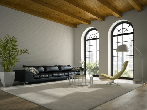 Bright modern living room with freshly painted white walls and exposed wood ceiling beams by AR Interiors Decoration Inc